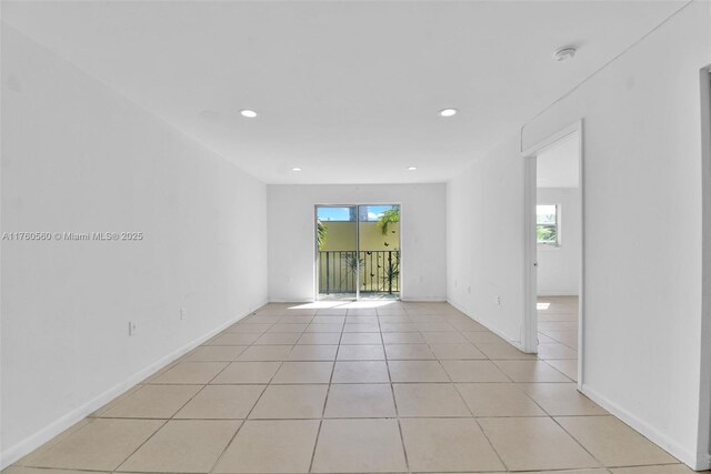 618 Euclid Ave Unit 303, Miami Beach, FL 33139 - unfurnished room with plenty of natural light, light tile patterned floors, recessed lighting, and a smoke detector