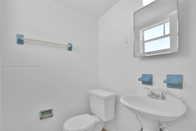618 Euclid Ave Unit 303, Miami Beach, FL 33139 - bathroom featuring toilet and baseboards