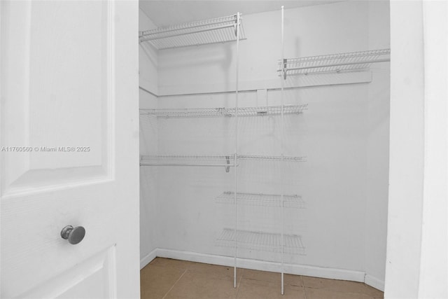 618 Euclid Ave Unit 303, Miami Beach, FL 33139 - spacious closet featuring tile patterned flooring