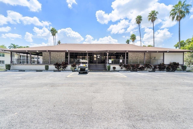 view of property featuring uncovered parking