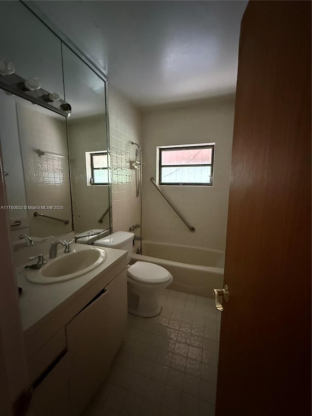 bathroom with vanity, toilet, and shower / bath combination