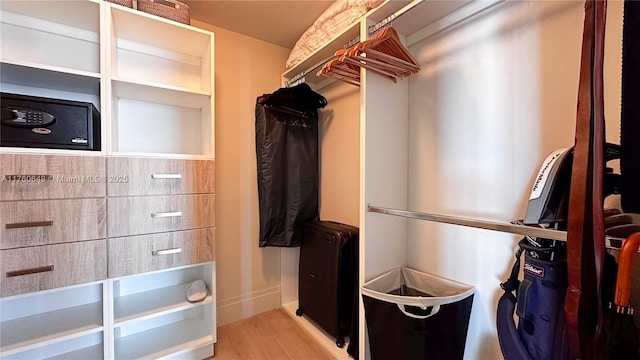 spacious closet featuring wood finished floors