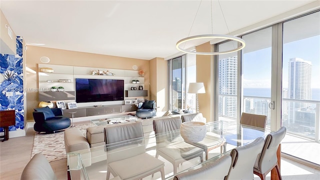 2600 E Hallandale Beach Blvd Unit T3101, Hallandale Beach, FL 33009 - dining area featuring healthy amount of natural light, wood finished floors, and expansive windows
