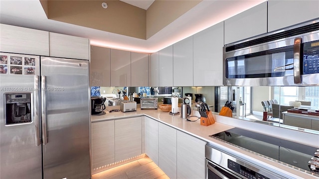 2600 E Hallandale Beach Blvd Unit T3101, Hallandale Beach, FL 33009 - kitchen featuring appliances with stainless steel finishes, modern cabinets, and light countertops