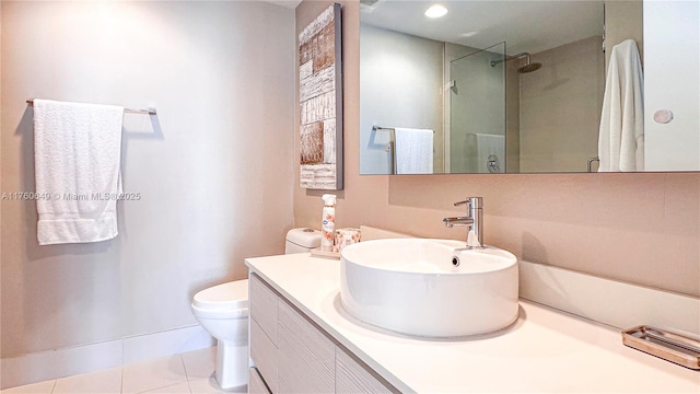 bathroom featuring a shower with door, toilet, tile patterned floors, and vanity