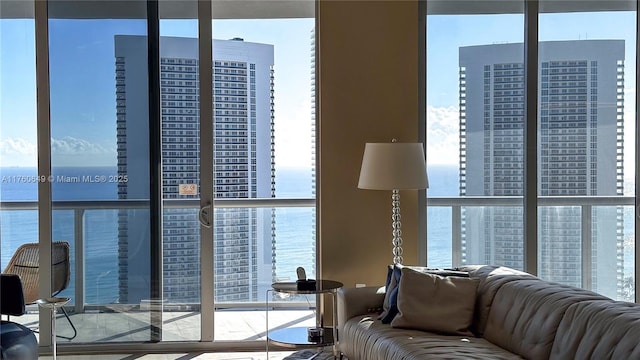 living area with plenty of natural light and a water view