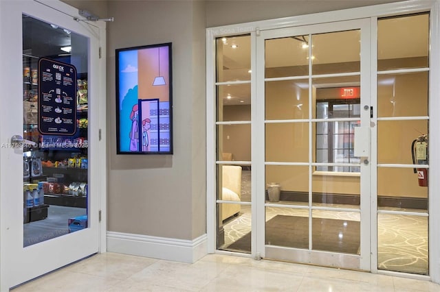 770 Claughton Island Dr Unit Ph-18, Miami, FL 33131 - doorway with tile patterned floors and baseboards