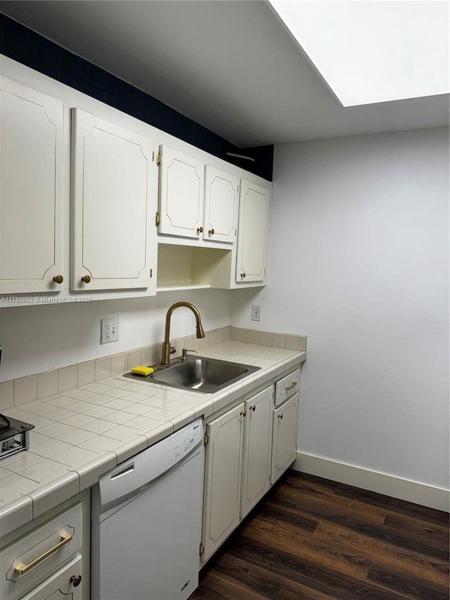 kitchen featuring a sink, baseboards, dishwasher, white cabinets, and dark wood-style flooring