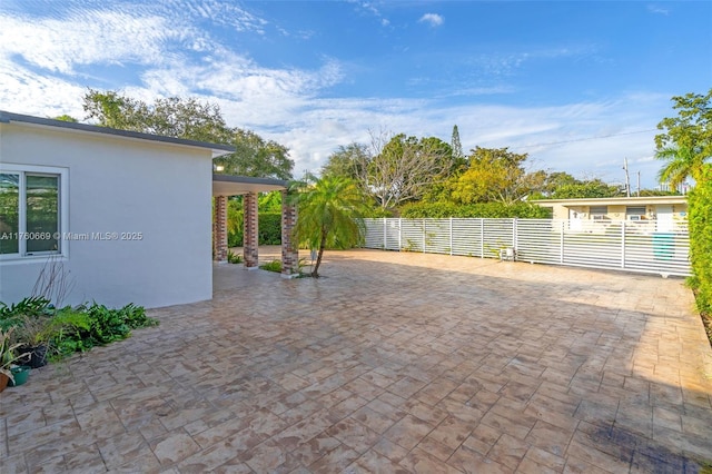 view of patio featuring fence