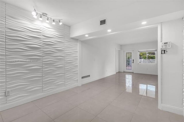 unfurnished room with tile patterned floors, visible vents, recessed lighting, and baseboards