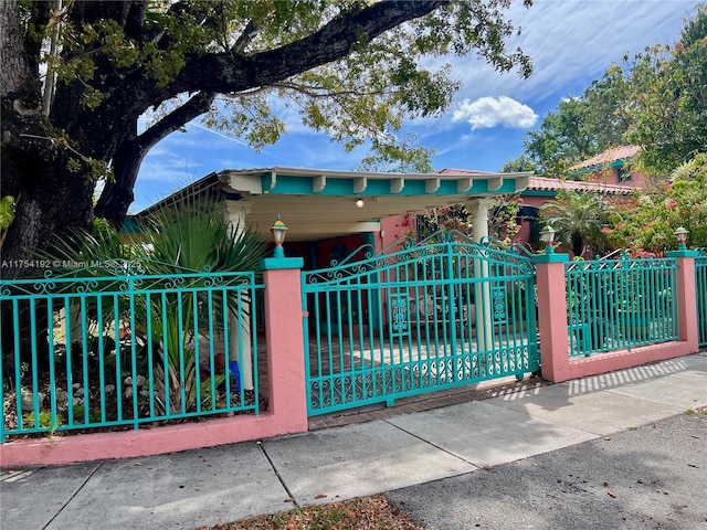 view of gate featuring a fenced front yard