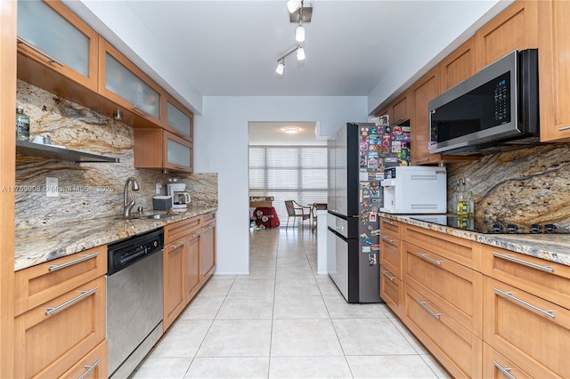 200 Leslie Dr Unit 430, Hallandale Beach, FL 33009 - kitchen with appliances with stainless steel finishes, light tile patterned floors, backsplash, a sink, and light stone countertops