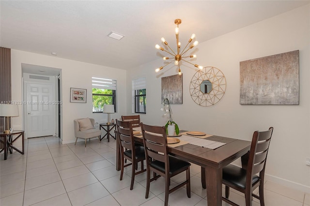 dining area featuring visible vents, baseboards, light tile patterned flooring, and a chandelier