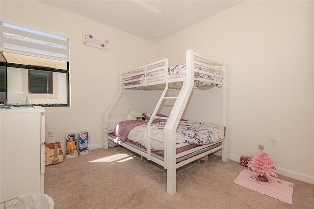 carpeted bedroom with baseboards