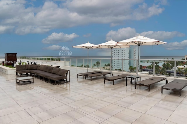 view of patio featuring an outdoor living space and a water view