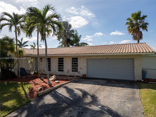 18200 SW 86th Ave, Palmetto Bay, FL 33157 - view of front of home featuring driveway, a tile roof, an attached garage, and stucco siding