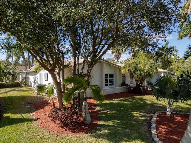 18200 SW 86th Ave, Palmetto Bay, FL 33157 - view of side of home featuring a lawn and stucco siding