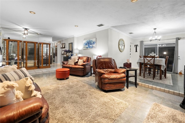 living room with light tile patterned floors, visible vents, a notable chandelier, and ornamental molding