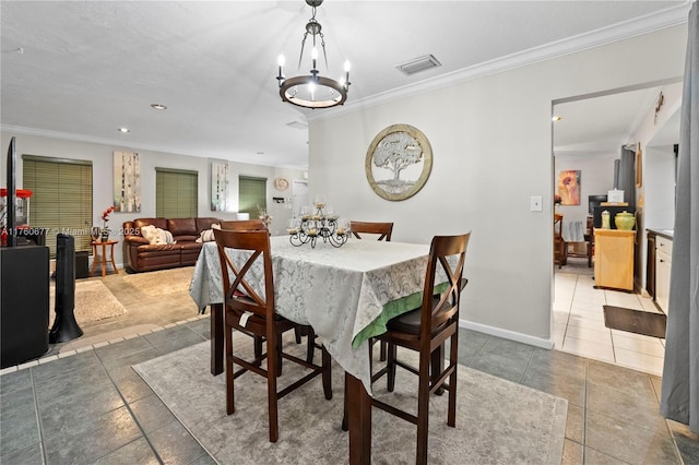 tiled dining room with visible vents, baseboards, ornamental molding, recessed lighting, and an inviting chandelier