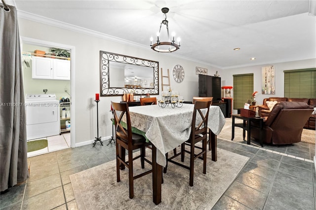 dining area with baseboards, washer / clothes dryer, crown molding, a notable chandelier, and tile patterned floors