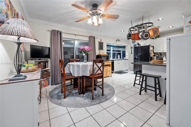 dining room with ceiling fan, light tile patterned floors, recessed lighting, and ornamental molding