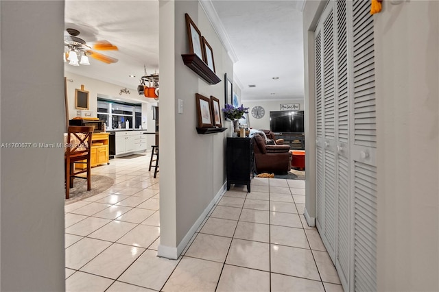 18200 SW 86th Ave, Palmetto Bay, FL 33157 - corridor with crown molding, light tile patterned floors, and baseboards