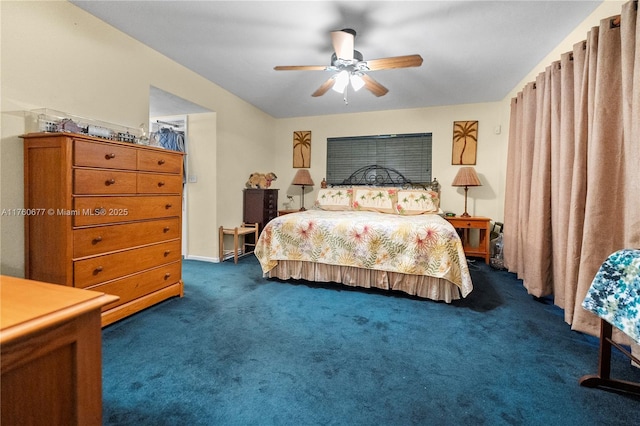 bedroom featuring dark colored carpet and ceiling fan