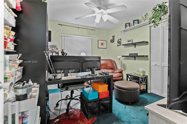 carpeted office featuring ceiling fan