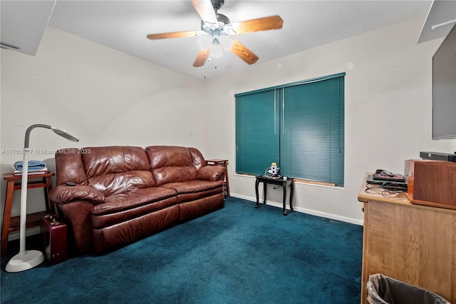 living area with baseboards, dark carpet, and ceiling fan