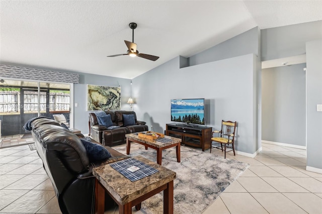 living area with lofted ceiling, light tile patterned flooring, baseboards, and ceiling fan