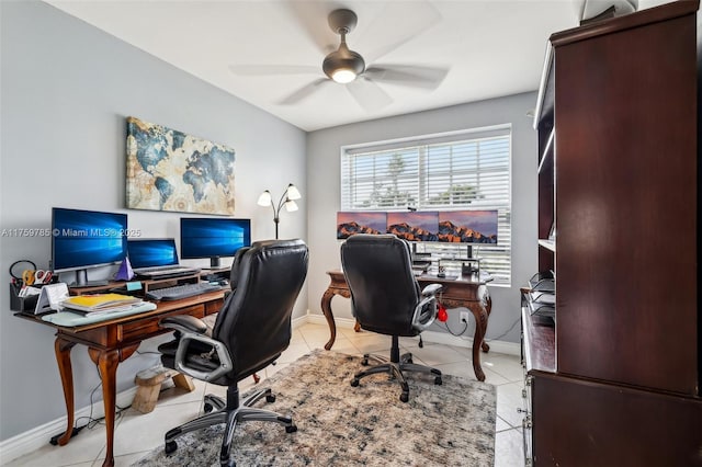 office space featuring light tile patterned floors, baseboards, and a ceiling fan