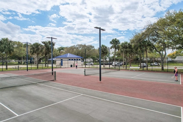 view of tennis court with fence