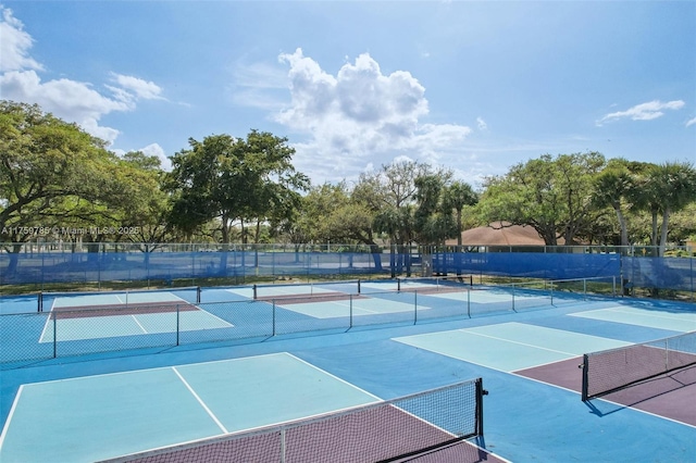 view of sport court with fence