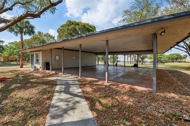 view of parking featuring a carport