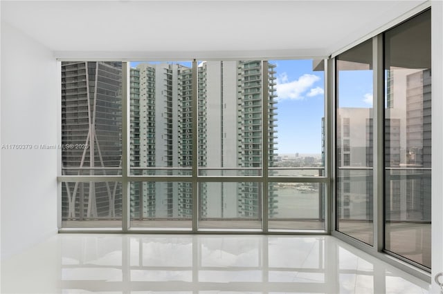 interior space with floor to ceiling windows and a view of city