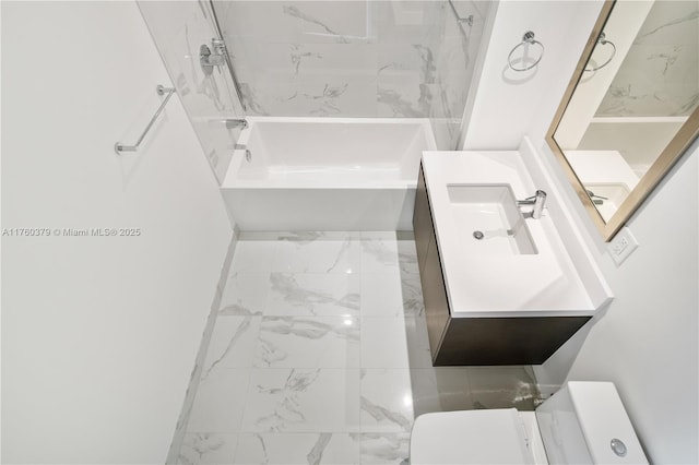 bathroom with vanity, bathing tub / shower combination, and toilet