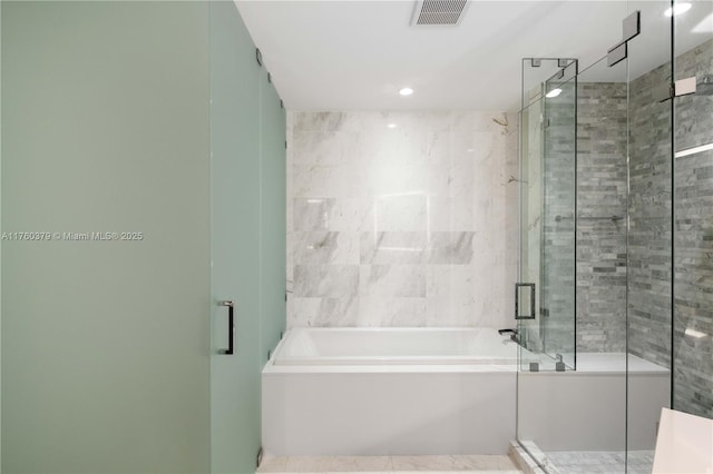 full bath with visible vents, recessed lighting, a stall shower, and a garden tub