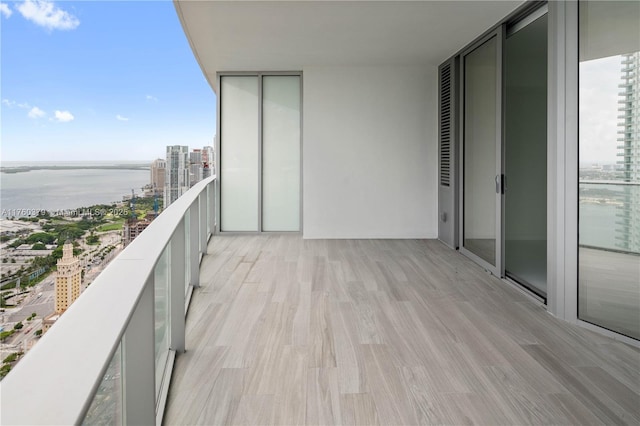 balcony featuring a water view