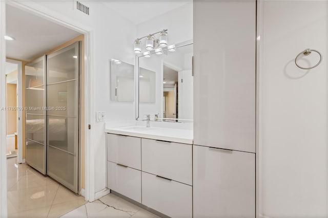 bathroom featuring visible vents and vanity