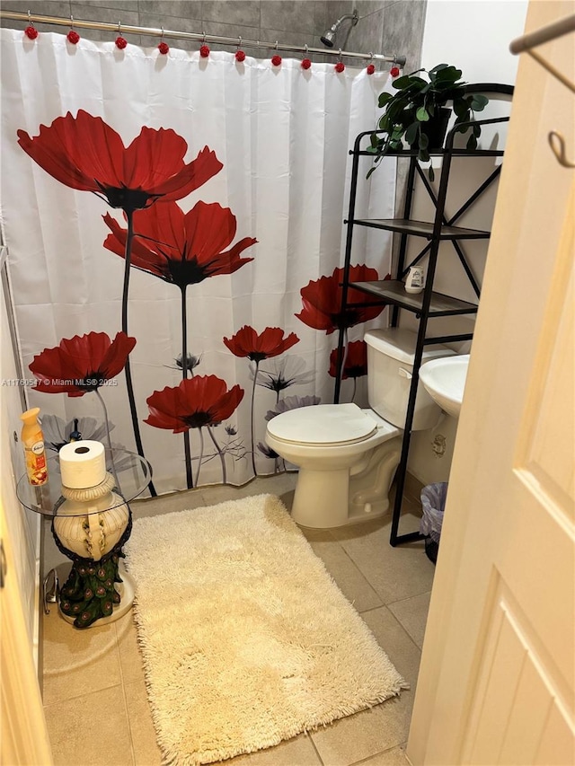 bathroom featuring tile patterned floors, toilet, and a shower with curtain