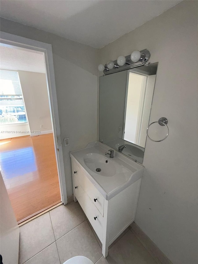 bathroom with tile patterned floors and vanity