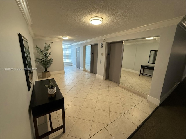 hallway featuring light tile patterned flooring, a textured ceiling, and crown molding