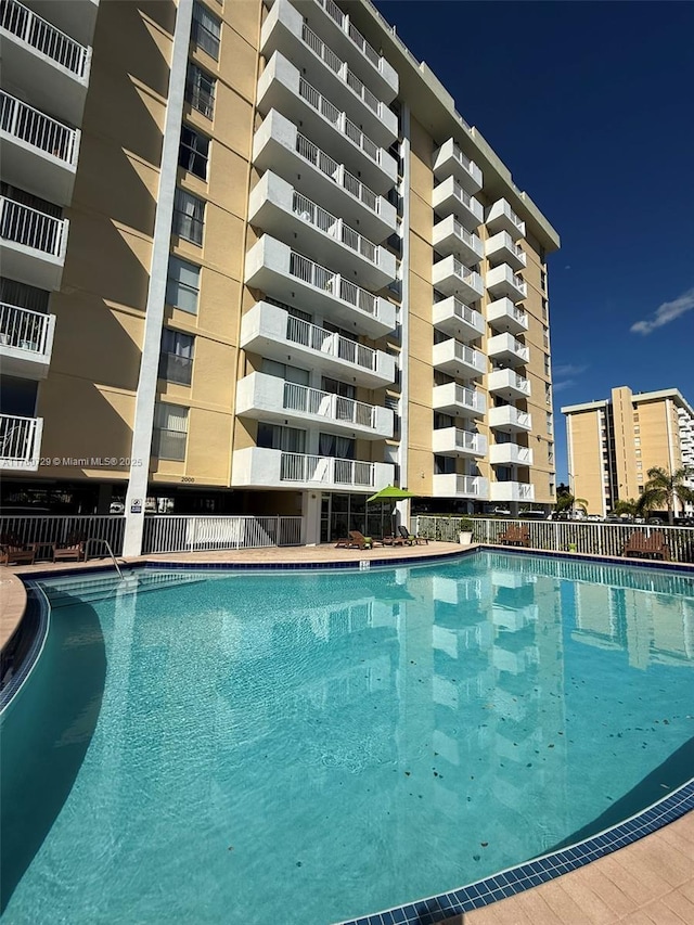 community pool featuring fence