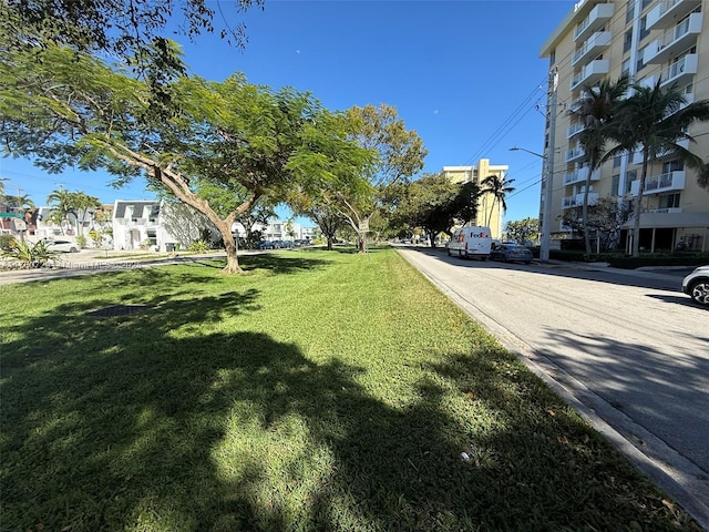 view of street with curbs and street lights