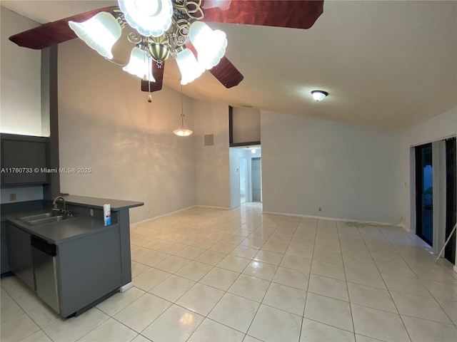 interior space with light tile patterned floors, baseboards, a ceiling fan, and vaulted ceiling