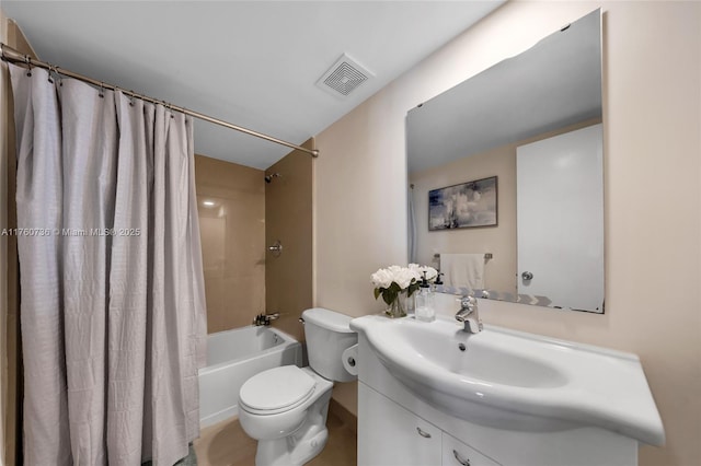 bathroom featuring visible vents, vanity, toilet, and shower / tub combo with curtain