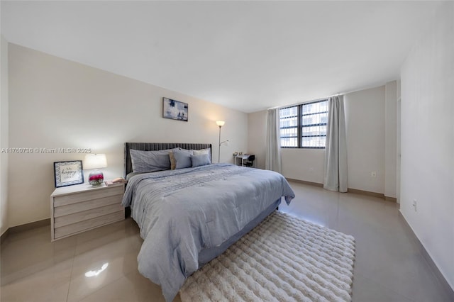 bedroom featuring baseboards