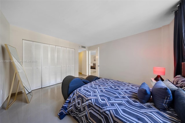 bedroom featuring a closet and visible vents