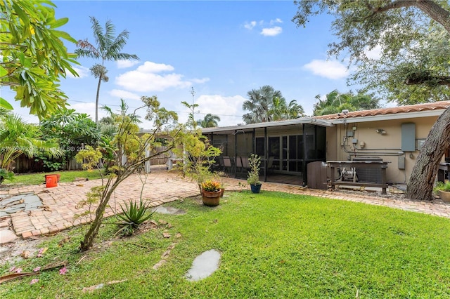 view of yard with a patio and a sunroom