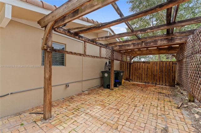 view of patio / terrace featuring a pergola and fence